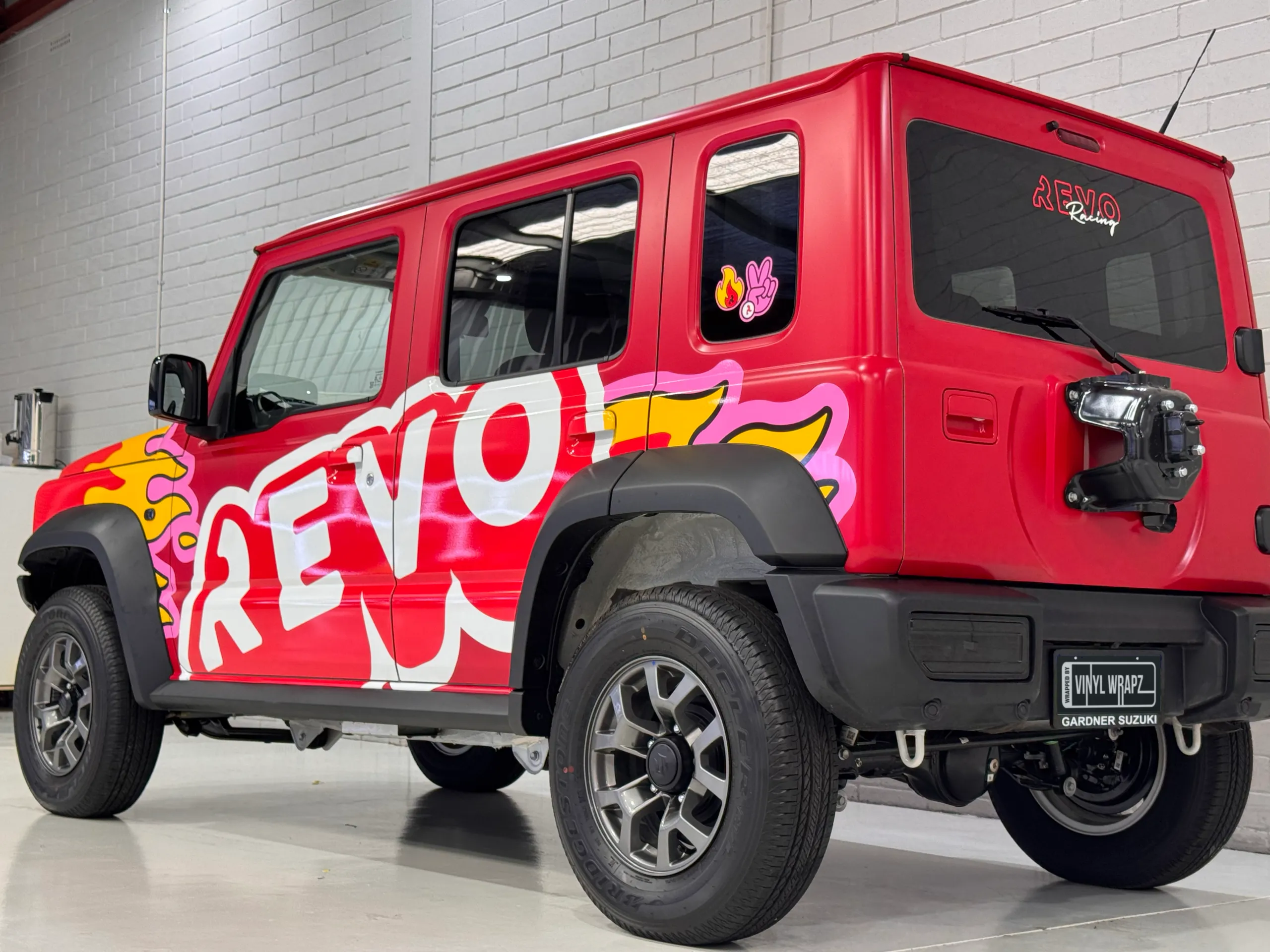 Revo Suzuki Jimny viewed from the rear quarter with the spare wheel removed