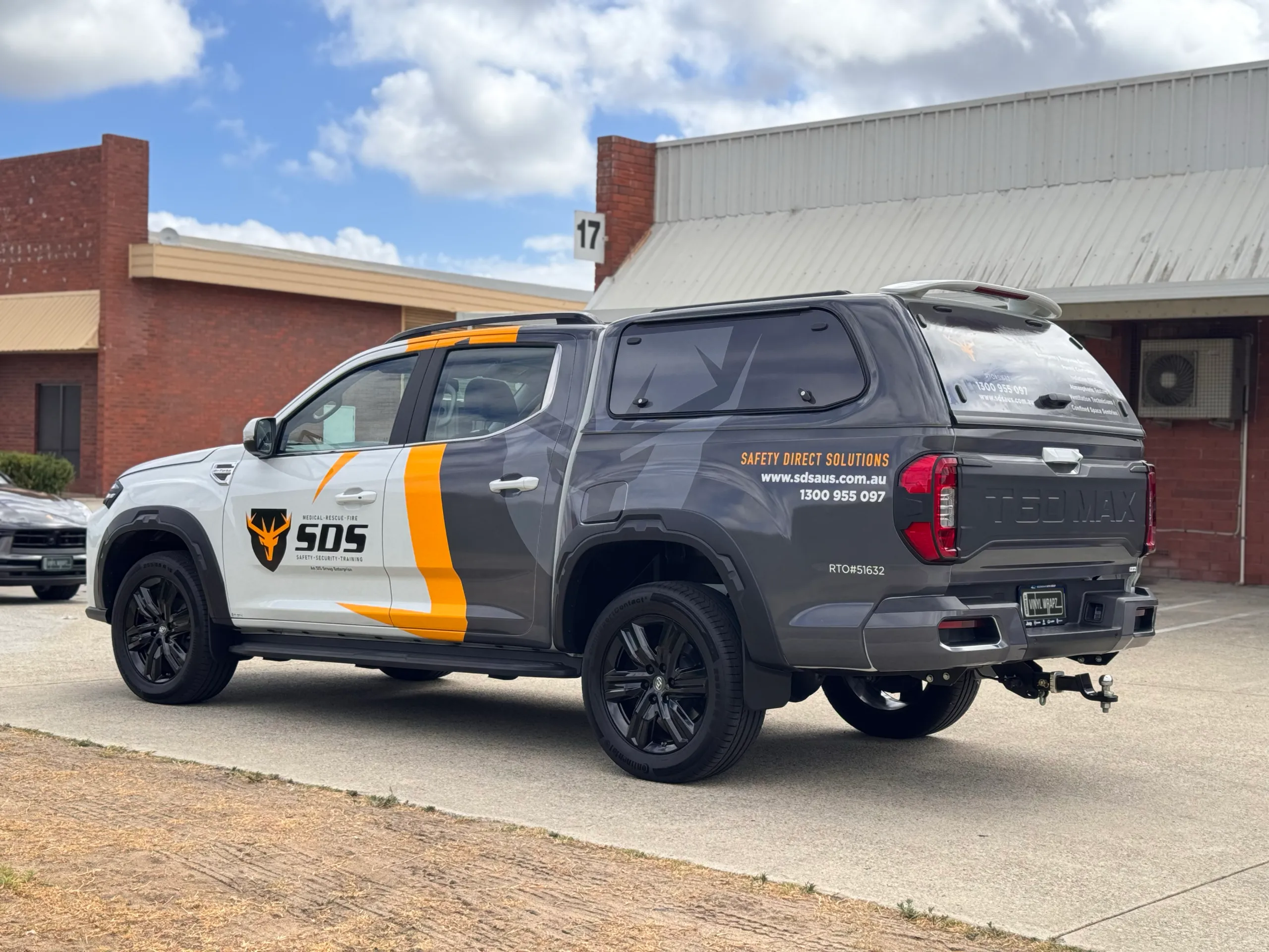 SDS LDV ute viewed from the rear quarter with grey canopy and yellow graphics