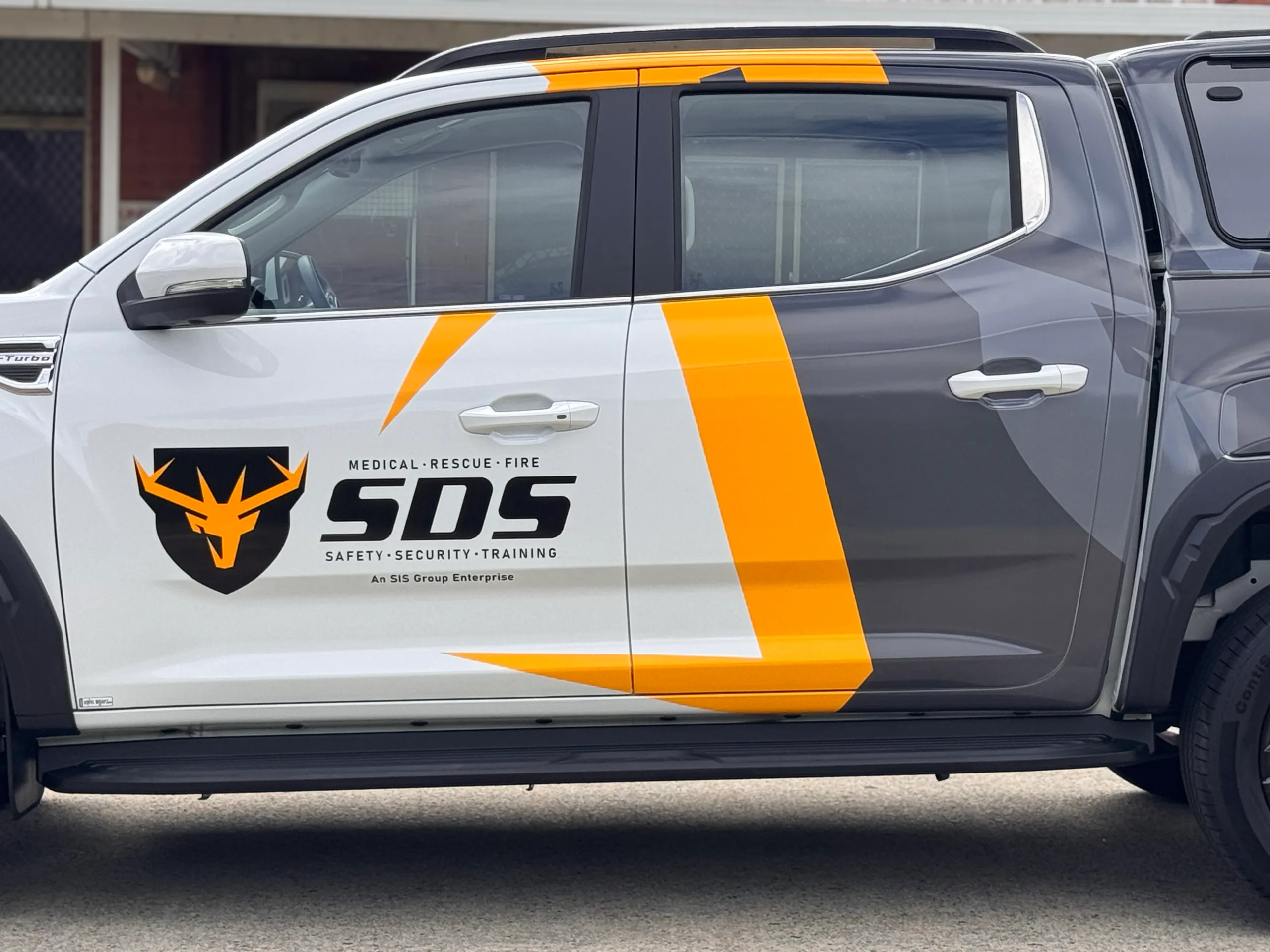 Safety Direct Solutions logo and yellow stripe across the LDV ute doors