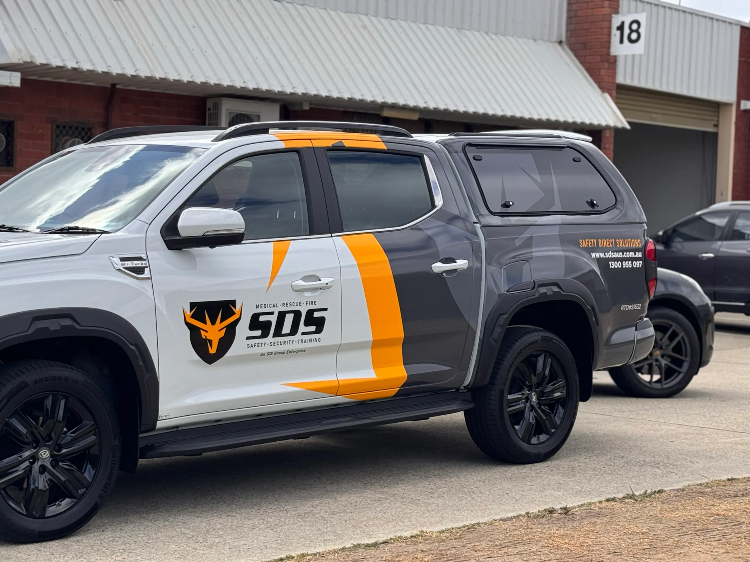 SDS door branding and grey canopy on the LDV ute outside the workshop