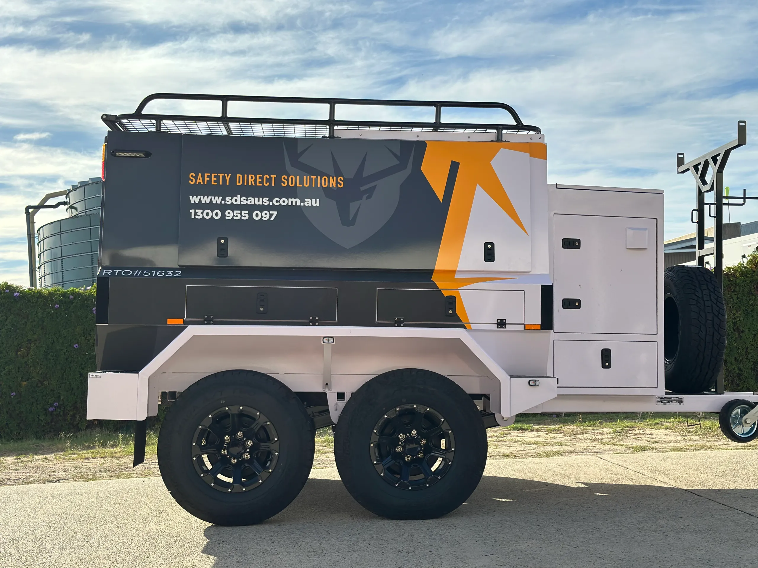 Safety Direct Solutions equipment trailer with grey graphics and yellow accents