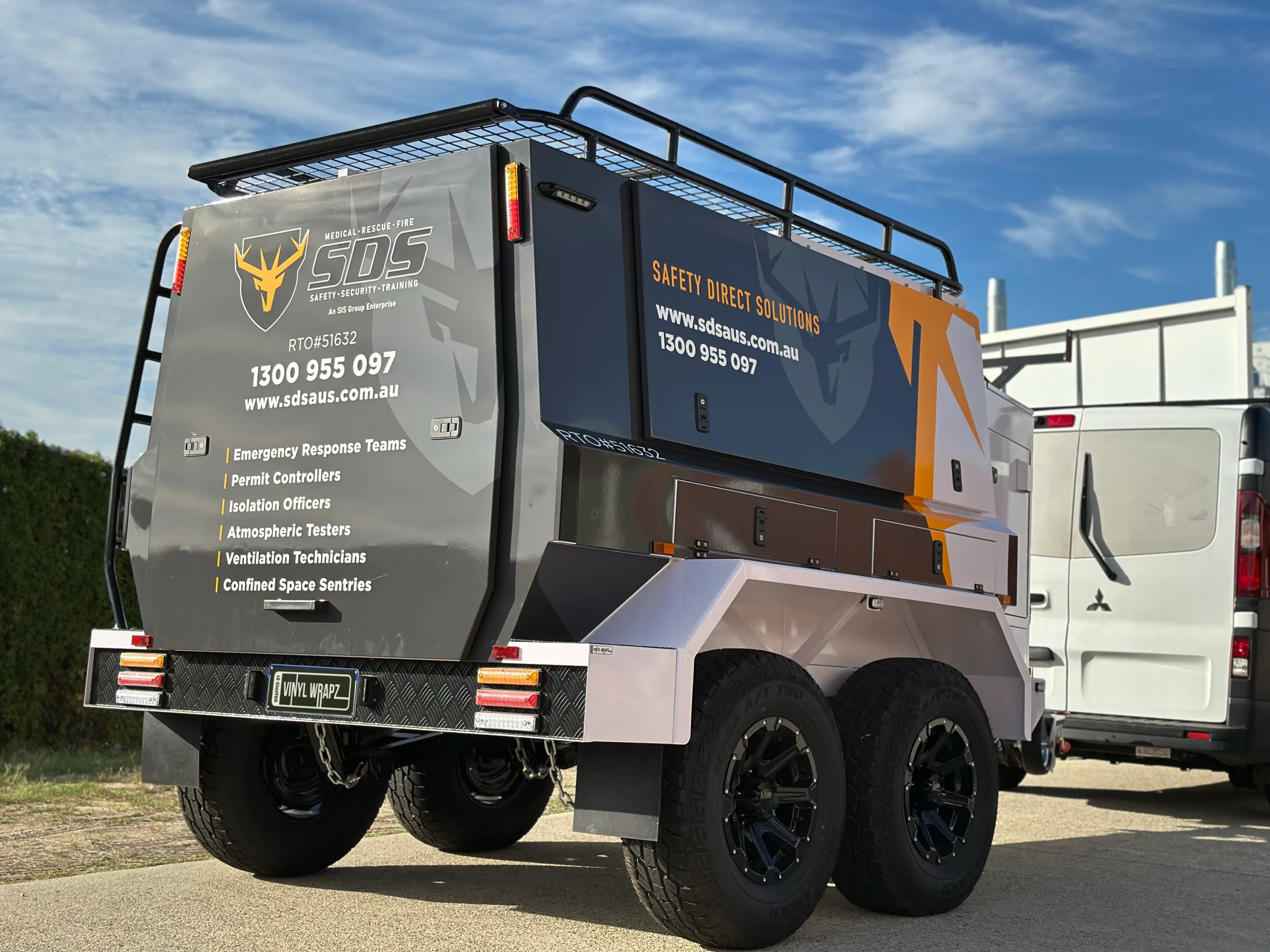 SDS branding and service lettering on the equipment trailer rear and side