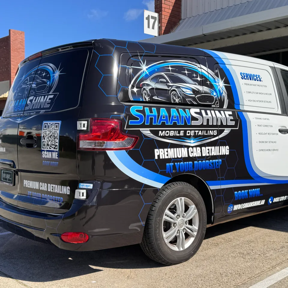Black, blue and white Shaan Shine Mobile Detailing graphics across a van's side and rear