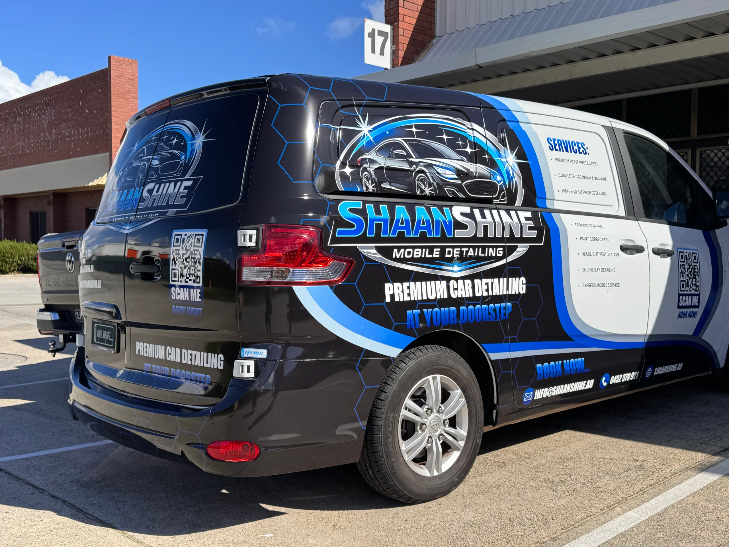 Black, blue and white Shaan Shine Mobile Detailing graphics across a van's side and rear