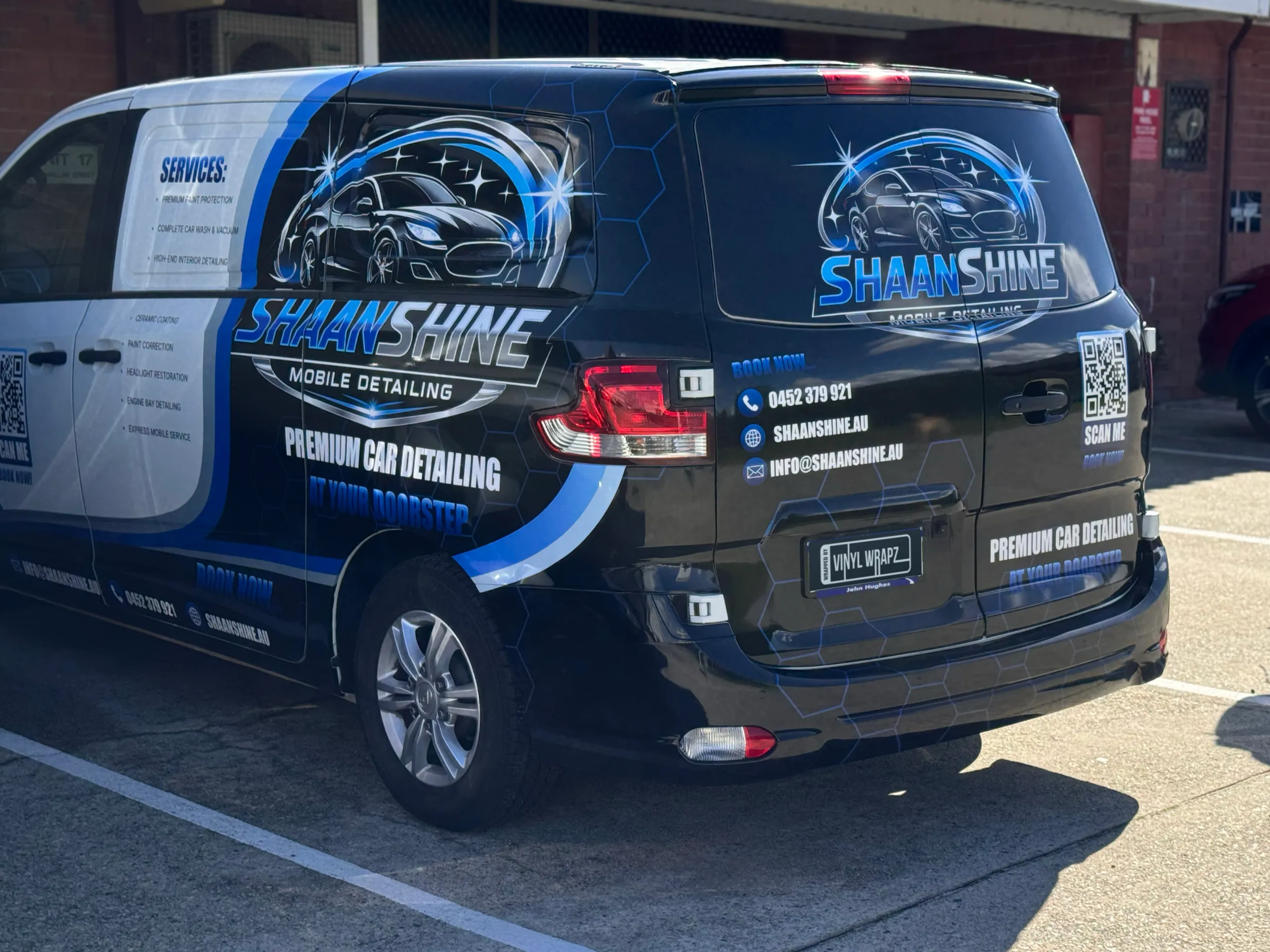 Rear and side branding on the Shaan Shine Mobile Detailing van outside the workshop