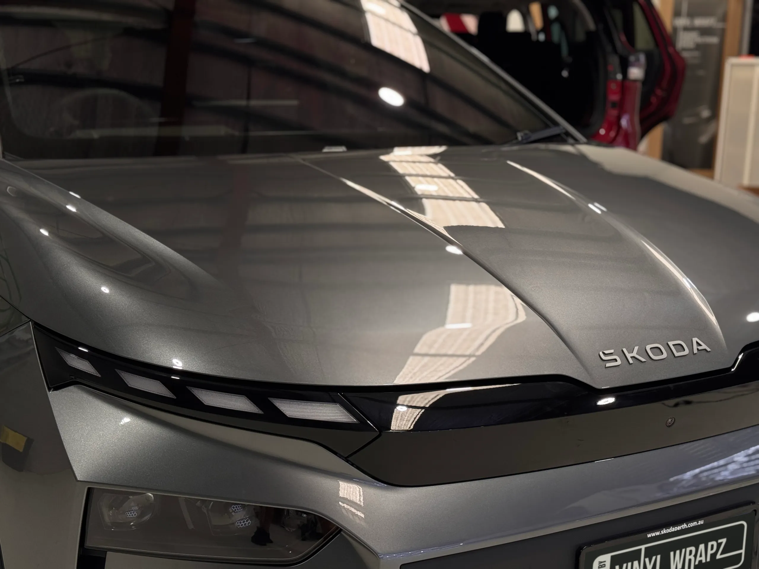 Close view of the grey Skoda Elroq bonnet and front lettering