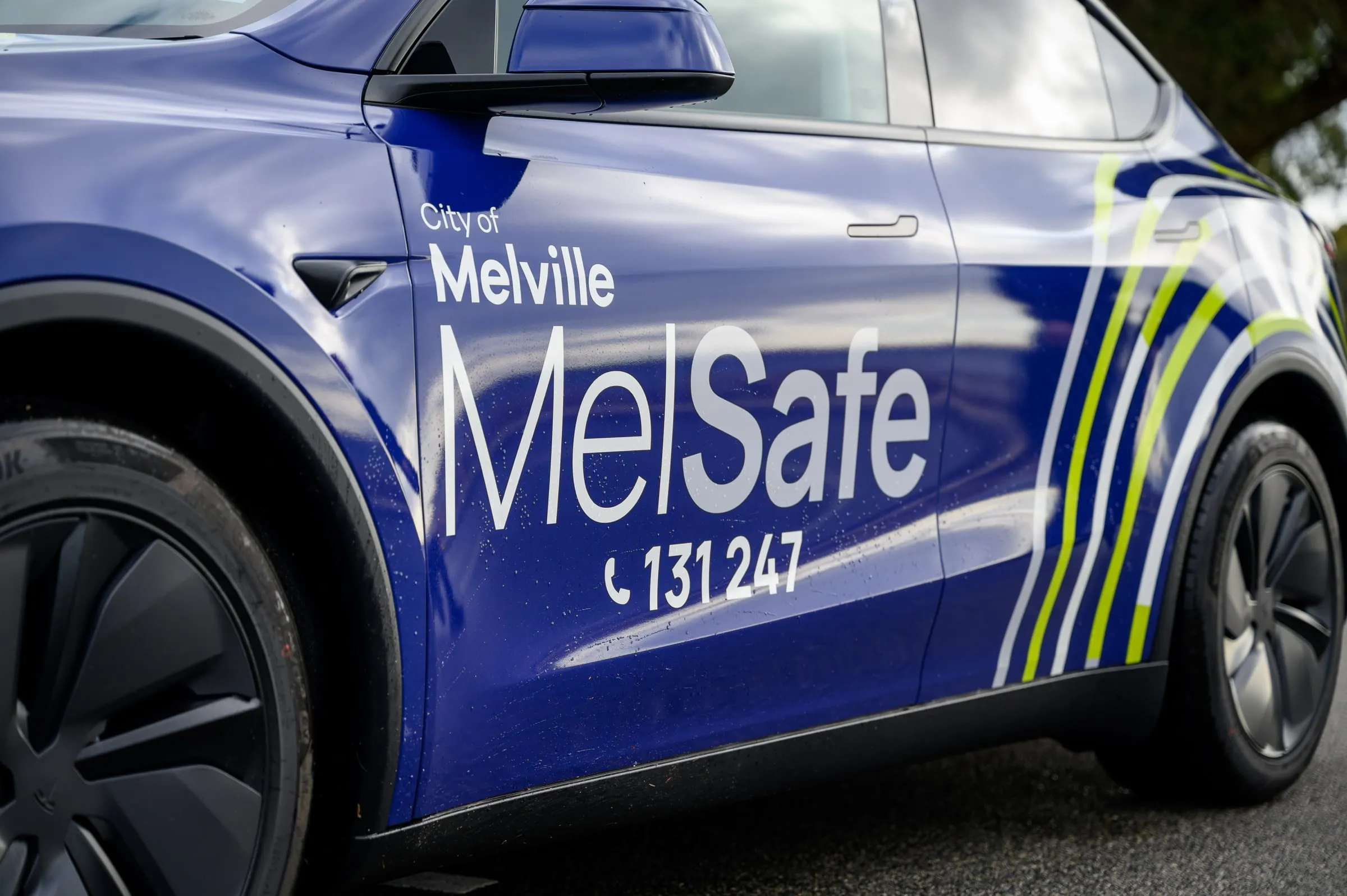 City of Melville MelSafe community service Tesla in a purple printed wrap with reflective livery