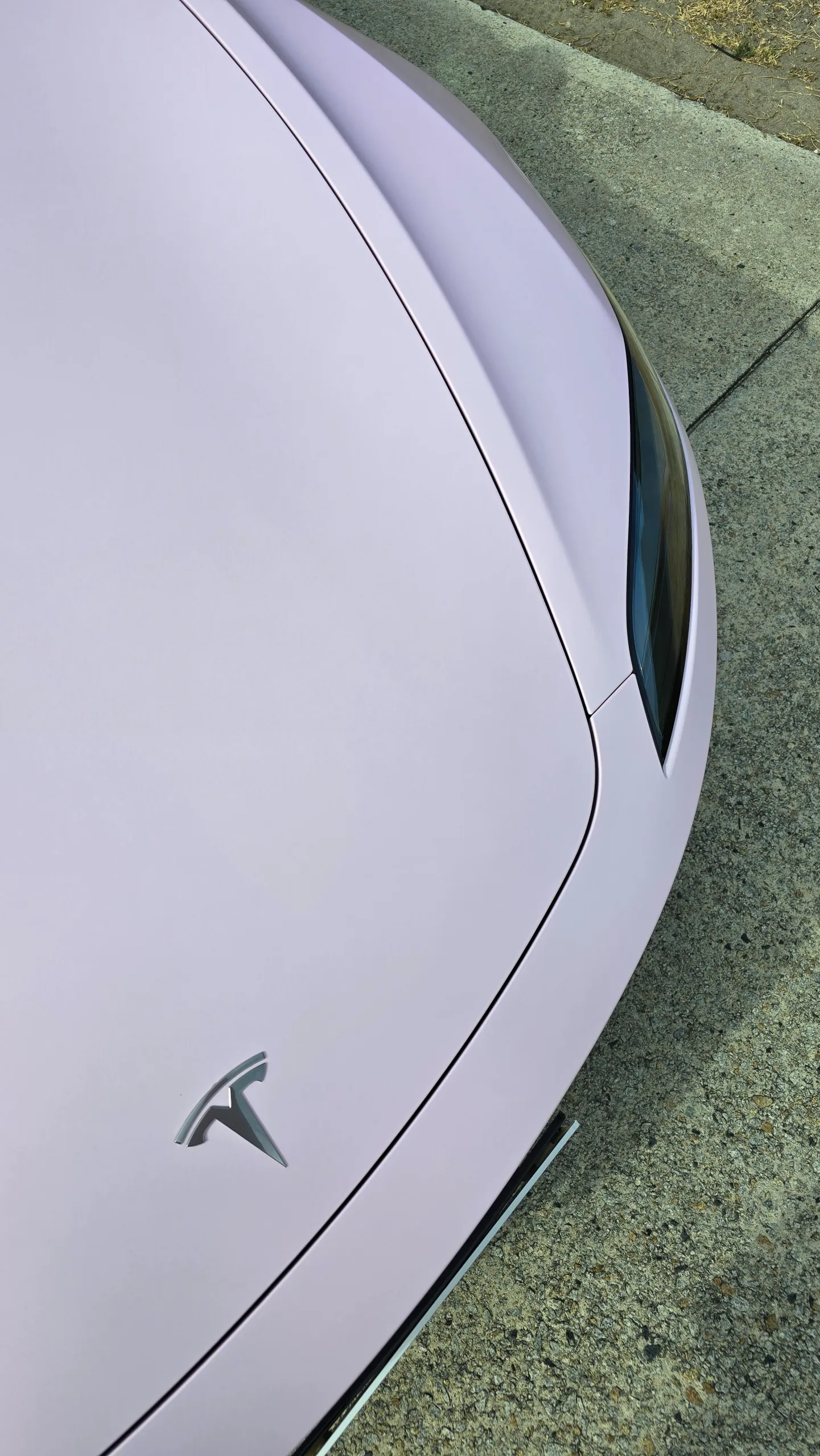 Pale pink satin Tesla Model 3 with black roof and wheels, bonnet detail