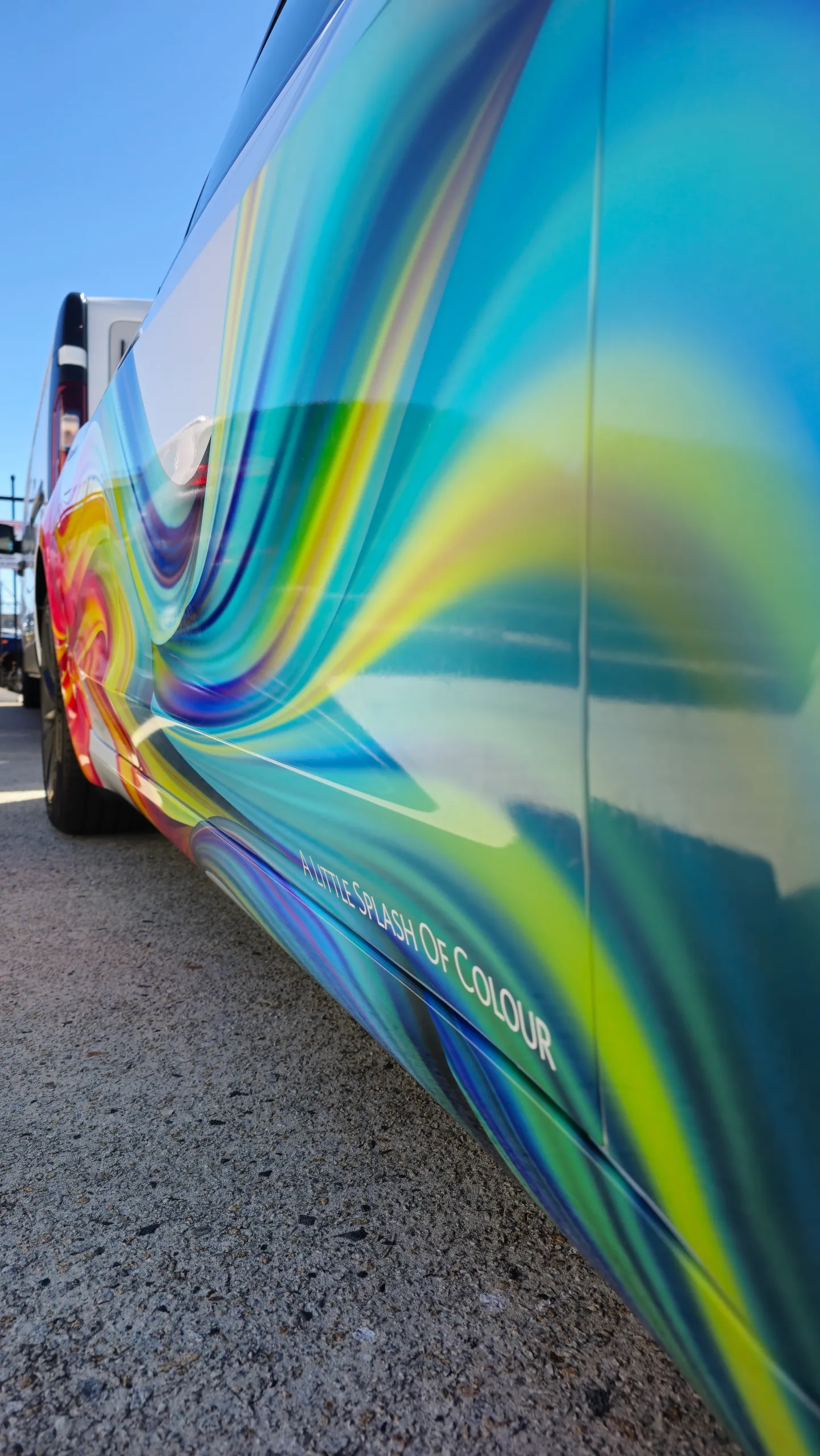 Portrait detail of the Tesla colourful printed side graphics