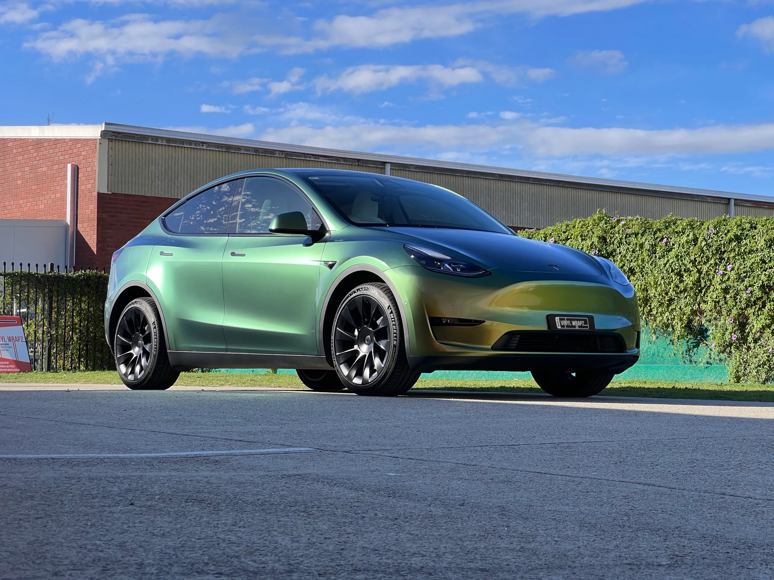 Golden green colour-shift Tesla Model Y, front quarter