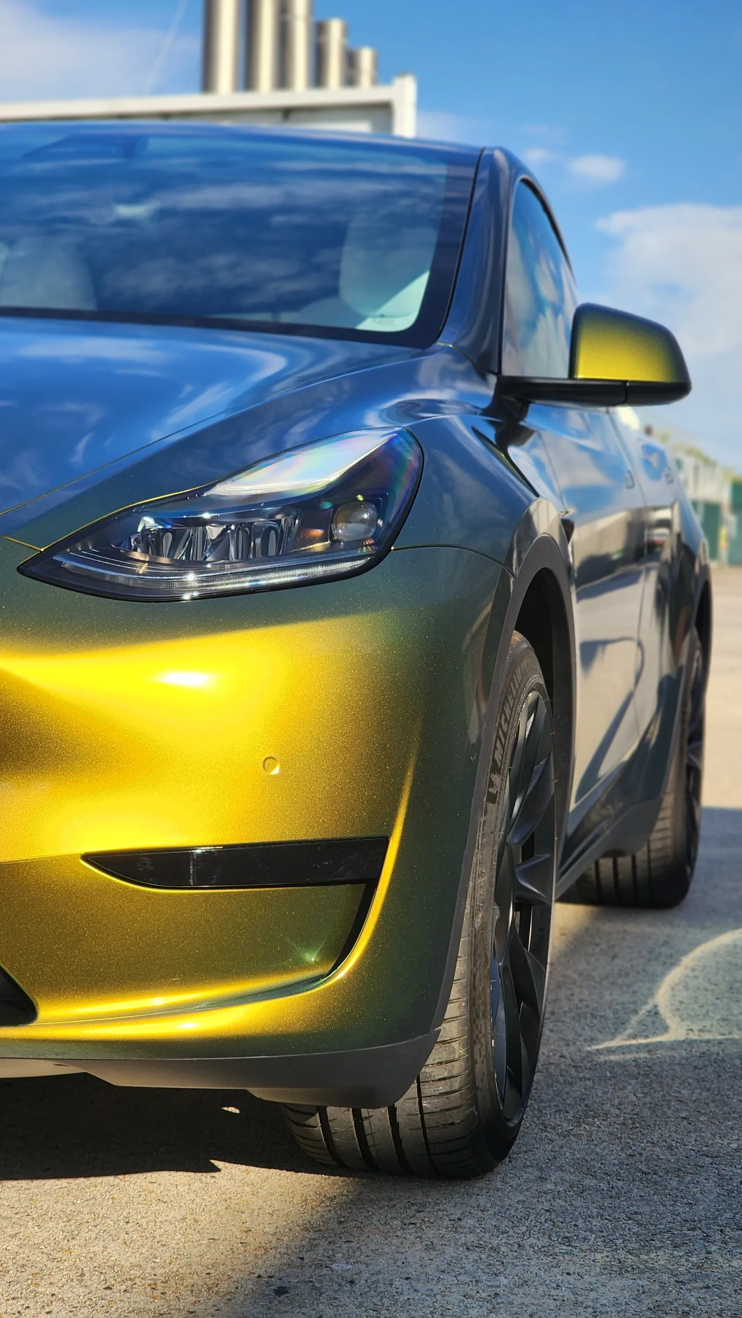 Golden green colour-shift Tesla Model Y, front detail