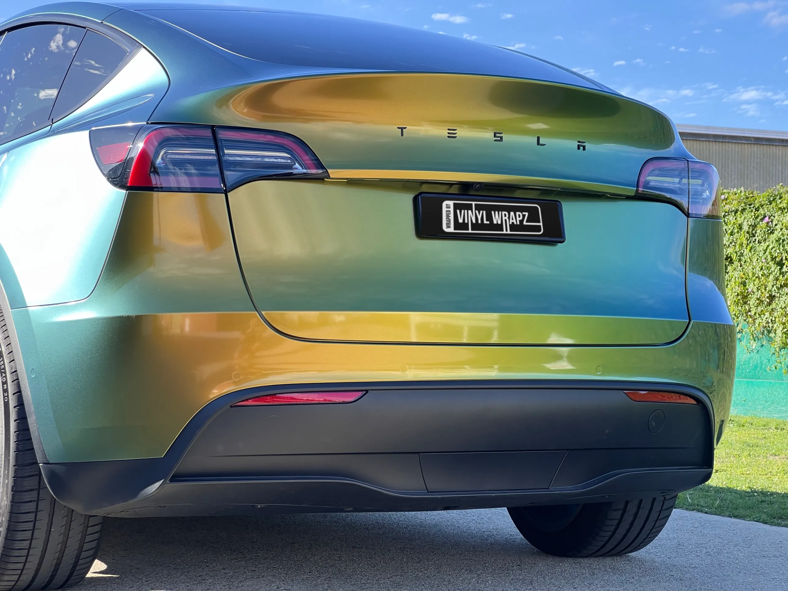 Golden green colour-shift Tesla Model Y, rear