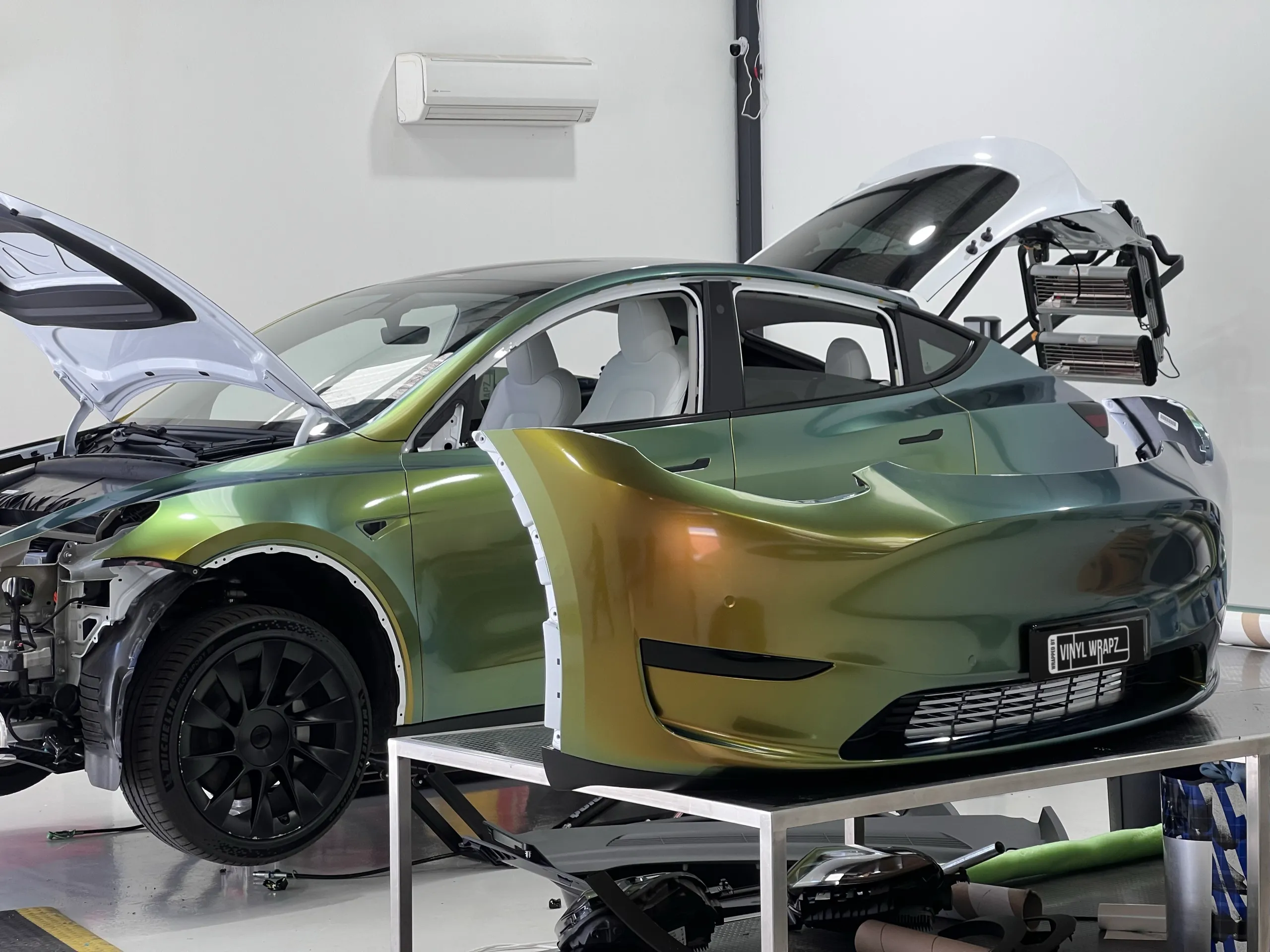 Golden green colour-shift Tesla Model Y, installation detail