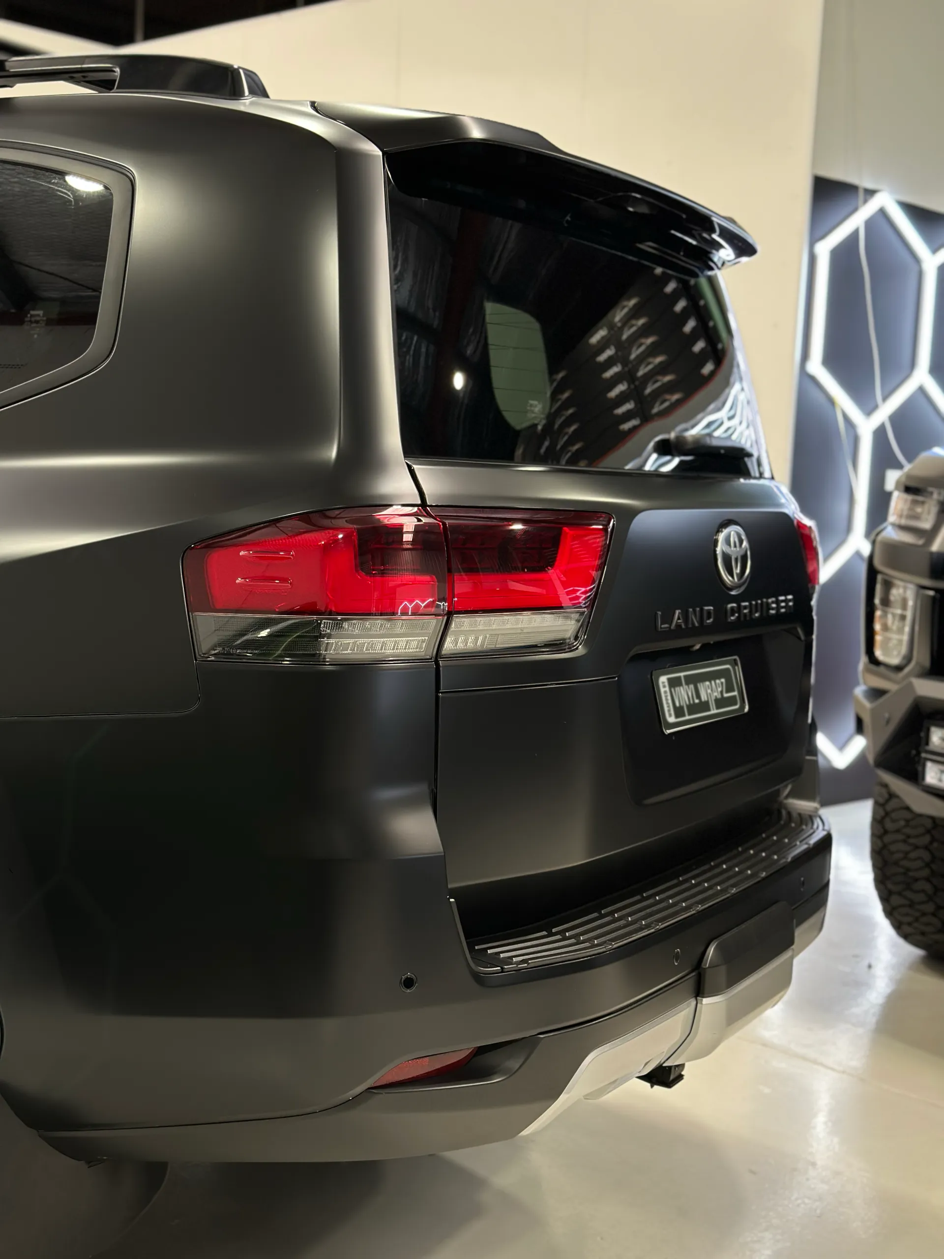 Matte black Toyota LandCruiser 300 rear corner and tailgate