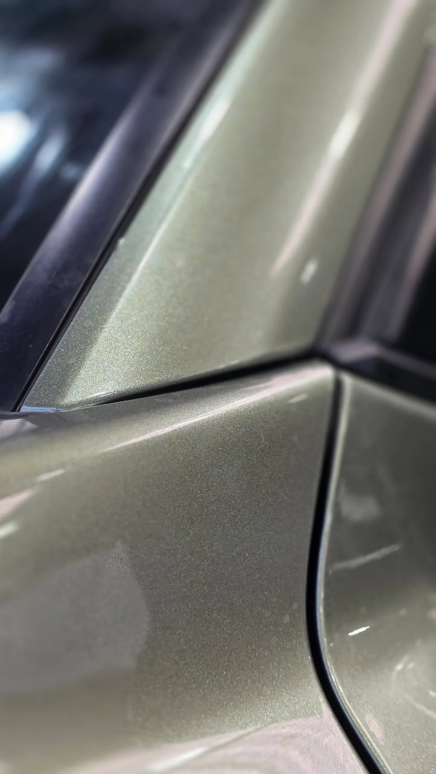 Close view of the green LandCruiser panel junction beside the windscreen