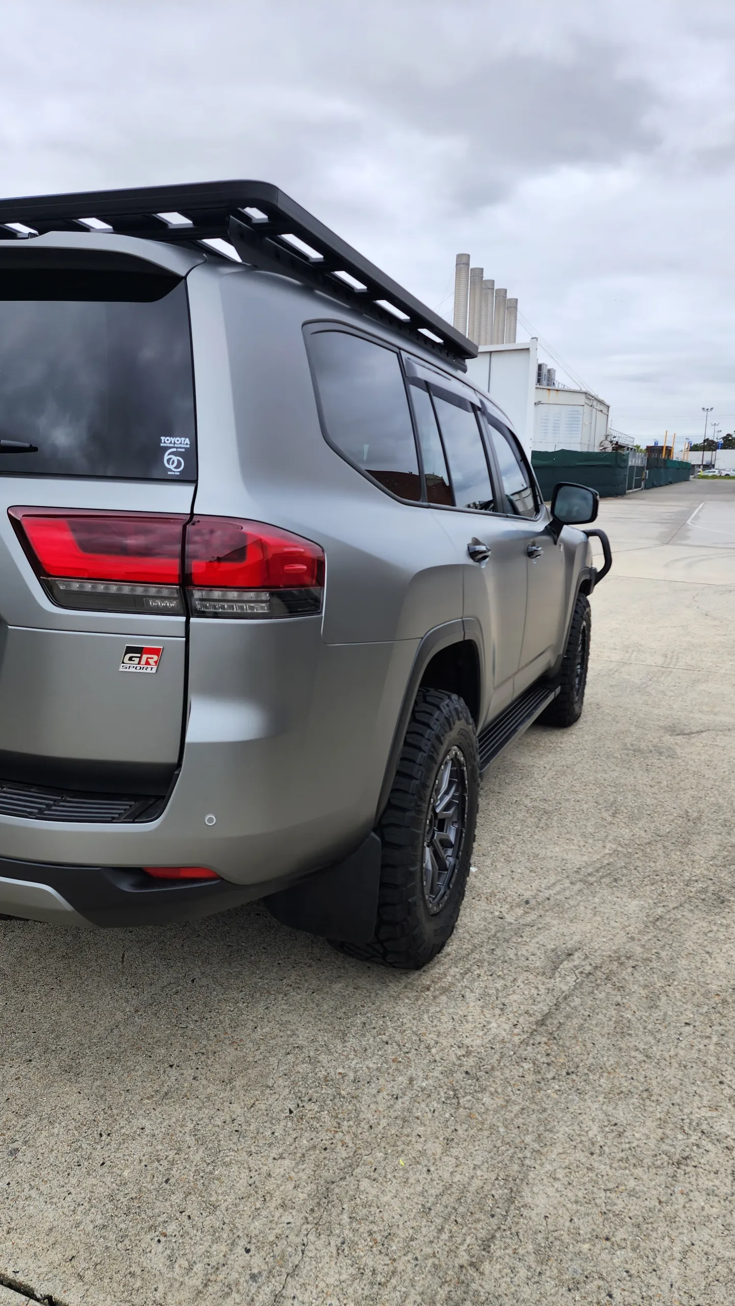 Matte slate grey Toyota LandCruiser 300 Series GR Sport, rear quarter