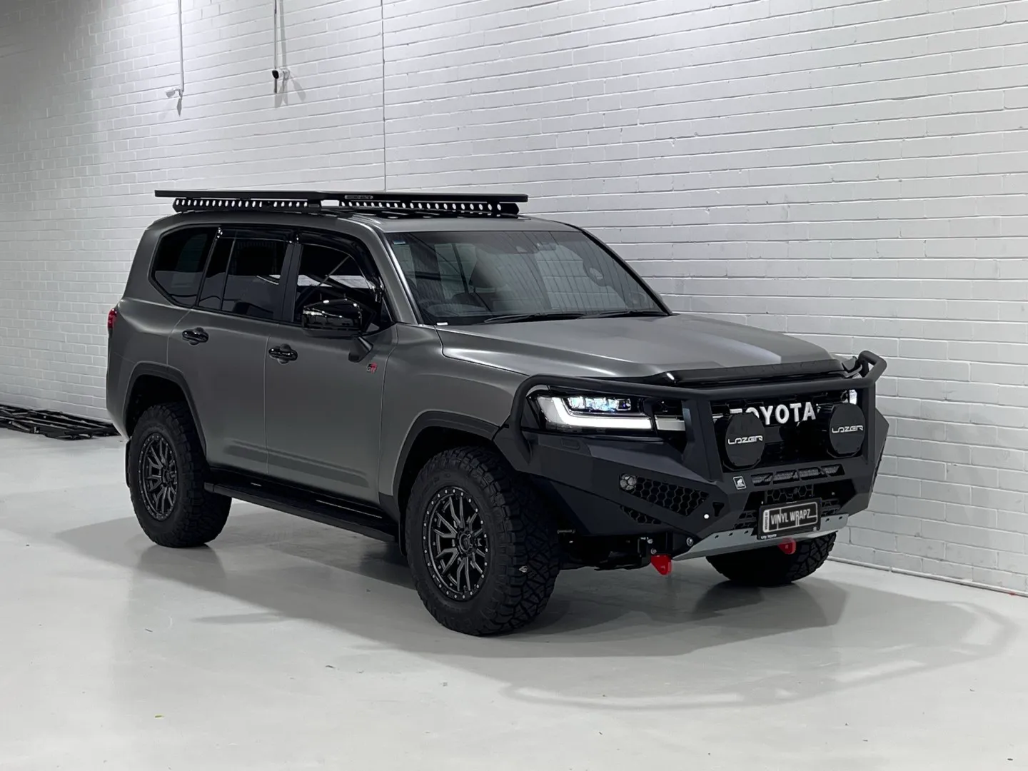 Matte slate grey Toyota LandCruiser 300 Series GR Sport, front quarter
