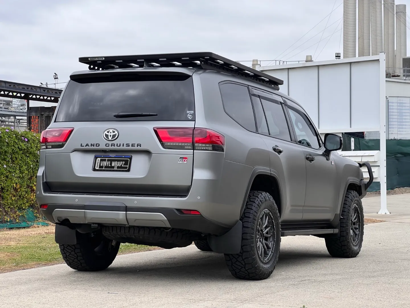 Matte slate grey Toyota LandCruiser 300 Series GR Sport, rear quarter