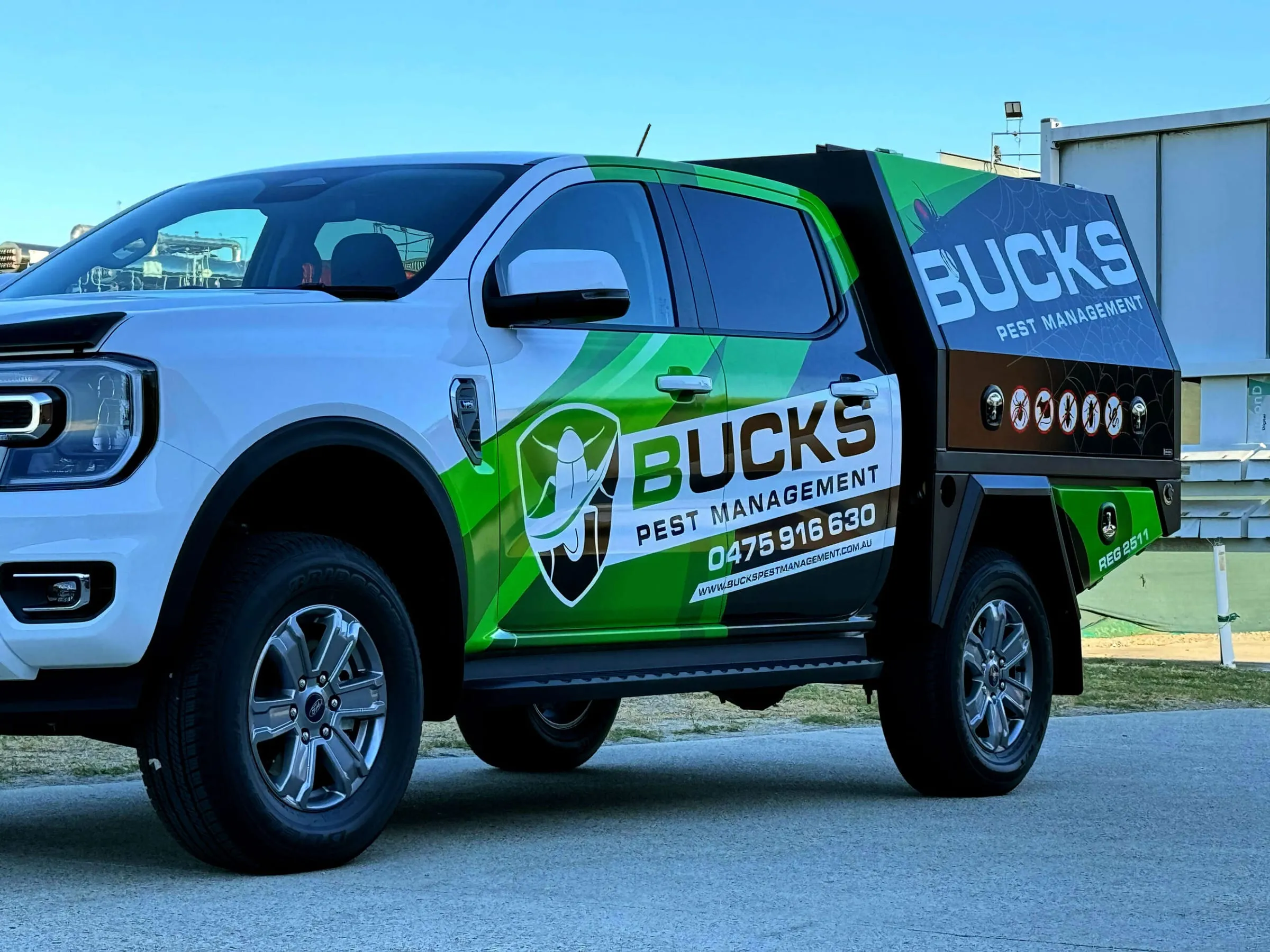 Ford Ranger work ute with partial vehicle branding across the doors and tray canopy, wrapped by Vinyl Wrapz in Osborne Park