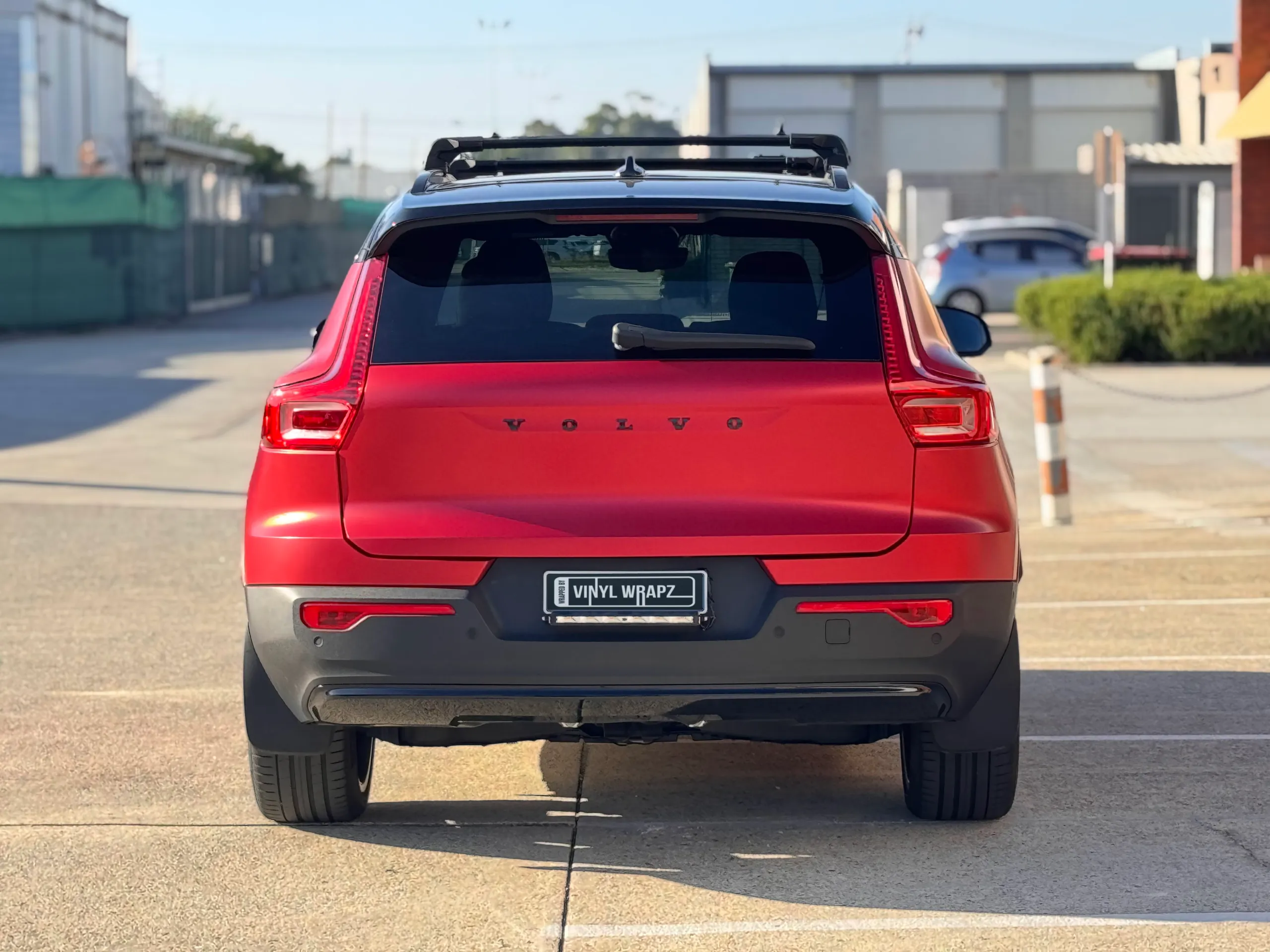 Rear view of the red Volvo XC40 parked outdoors