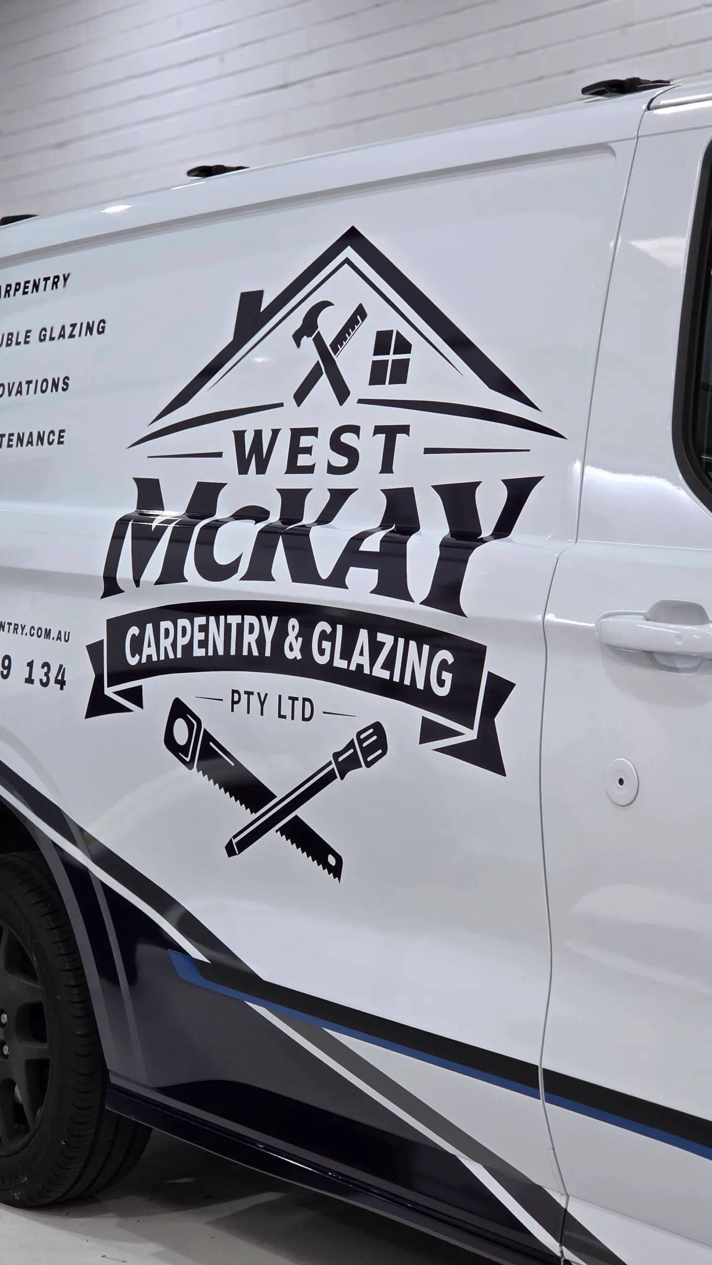 West McKay Carpentry and Glazing branding on the white Ford Transit Custom side door