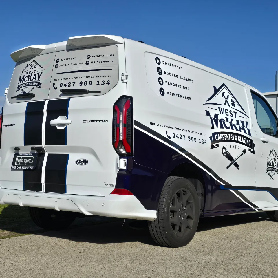 Ford Transit Custom with West McKay Carpentry and Glazing graphics outside the workshop