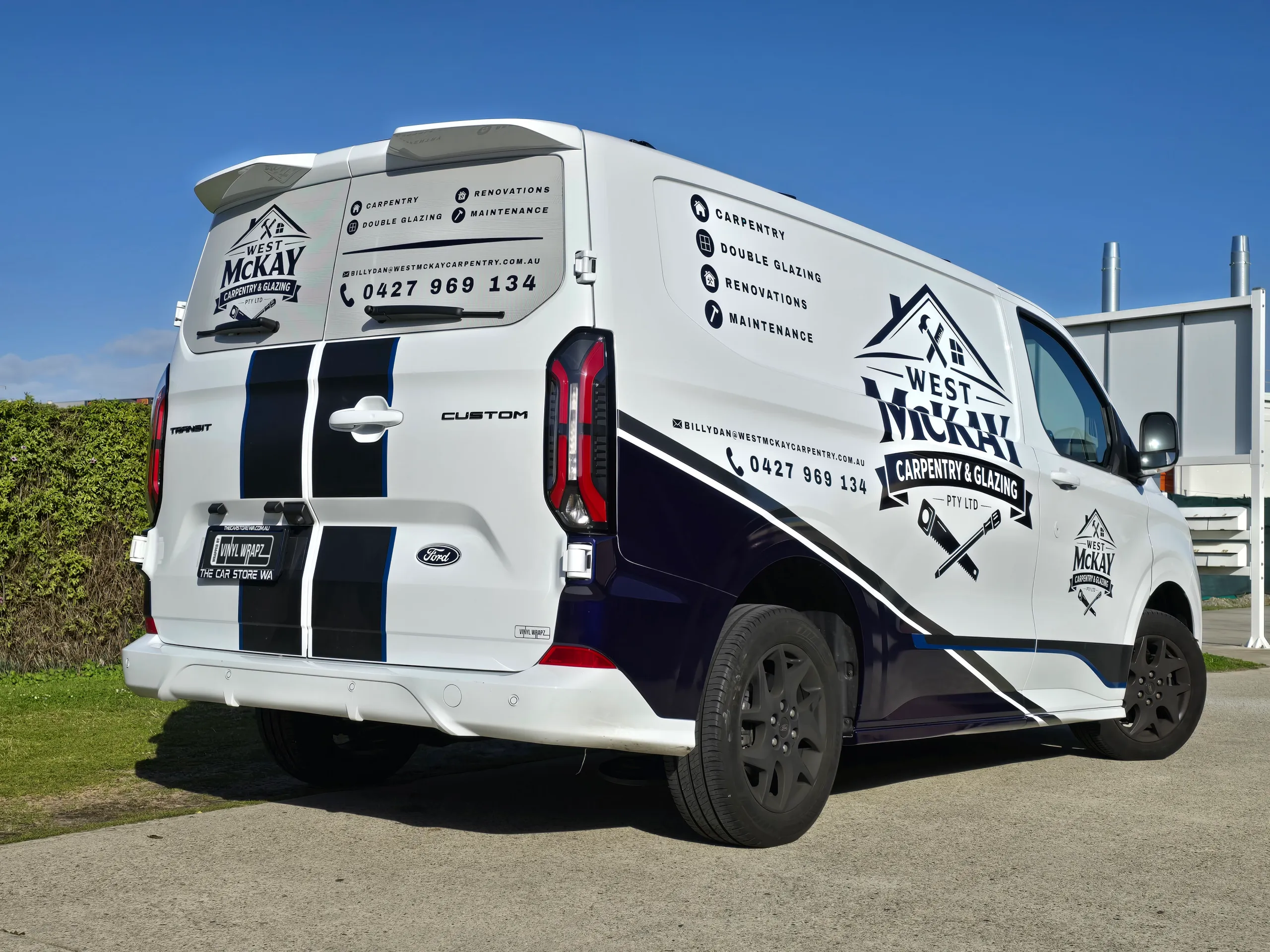 Ford Transit Custom with West McKay Carpentry and Glazing graphics outside the workshop