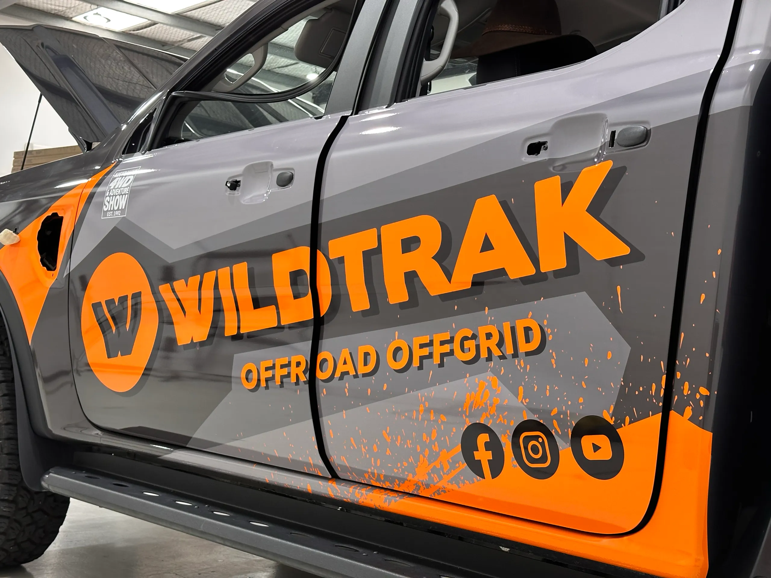 Wildtrak Offroad Offgrid graphics across Ford Ranger doors with the handles still removed