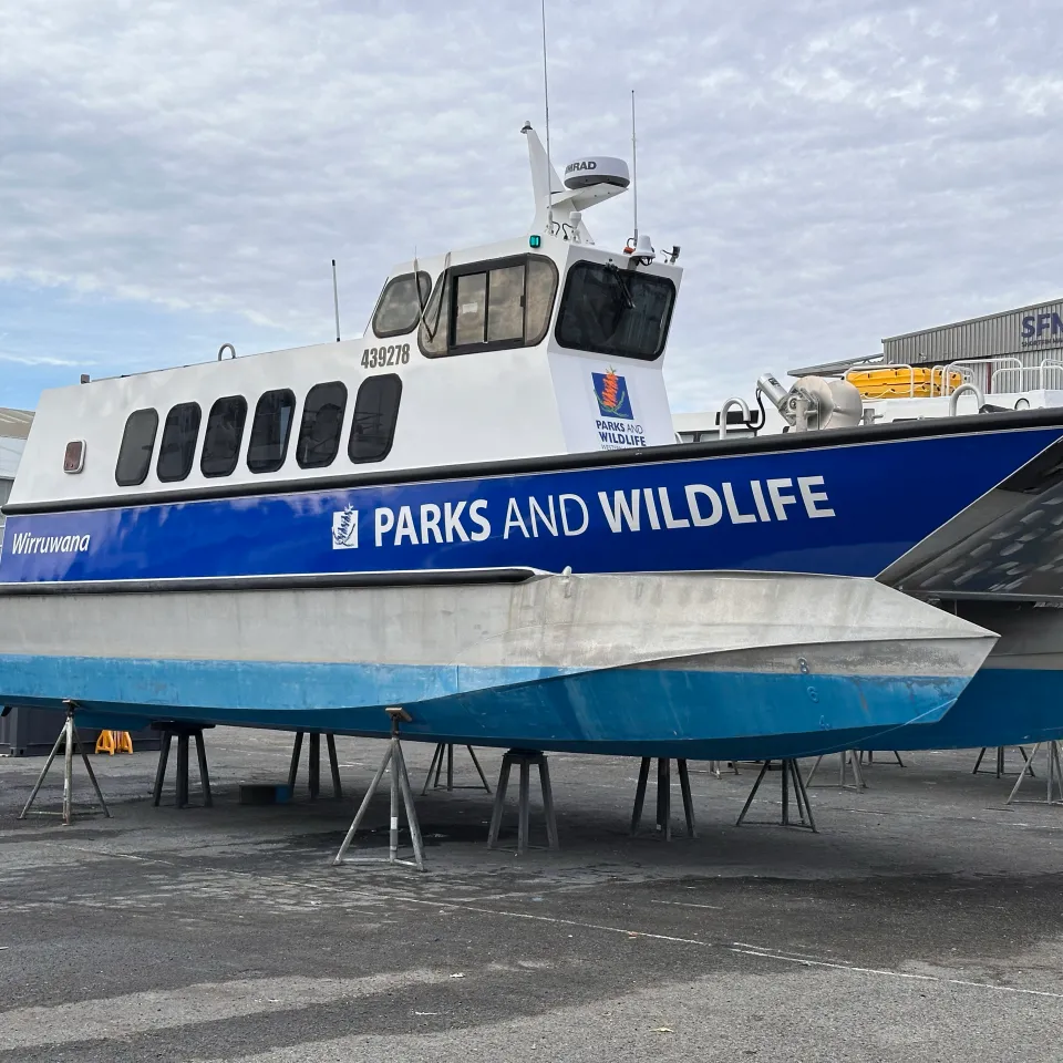 Wirruwana vessel on stands with blue Parks and Wildlife side graphics fitted