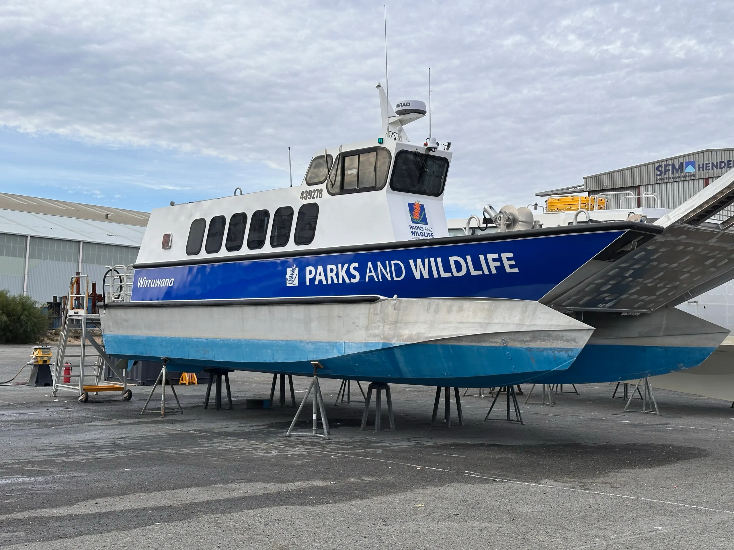 Blue Parks and Wildlife graphics and Wirruwana lettering along the vessel side