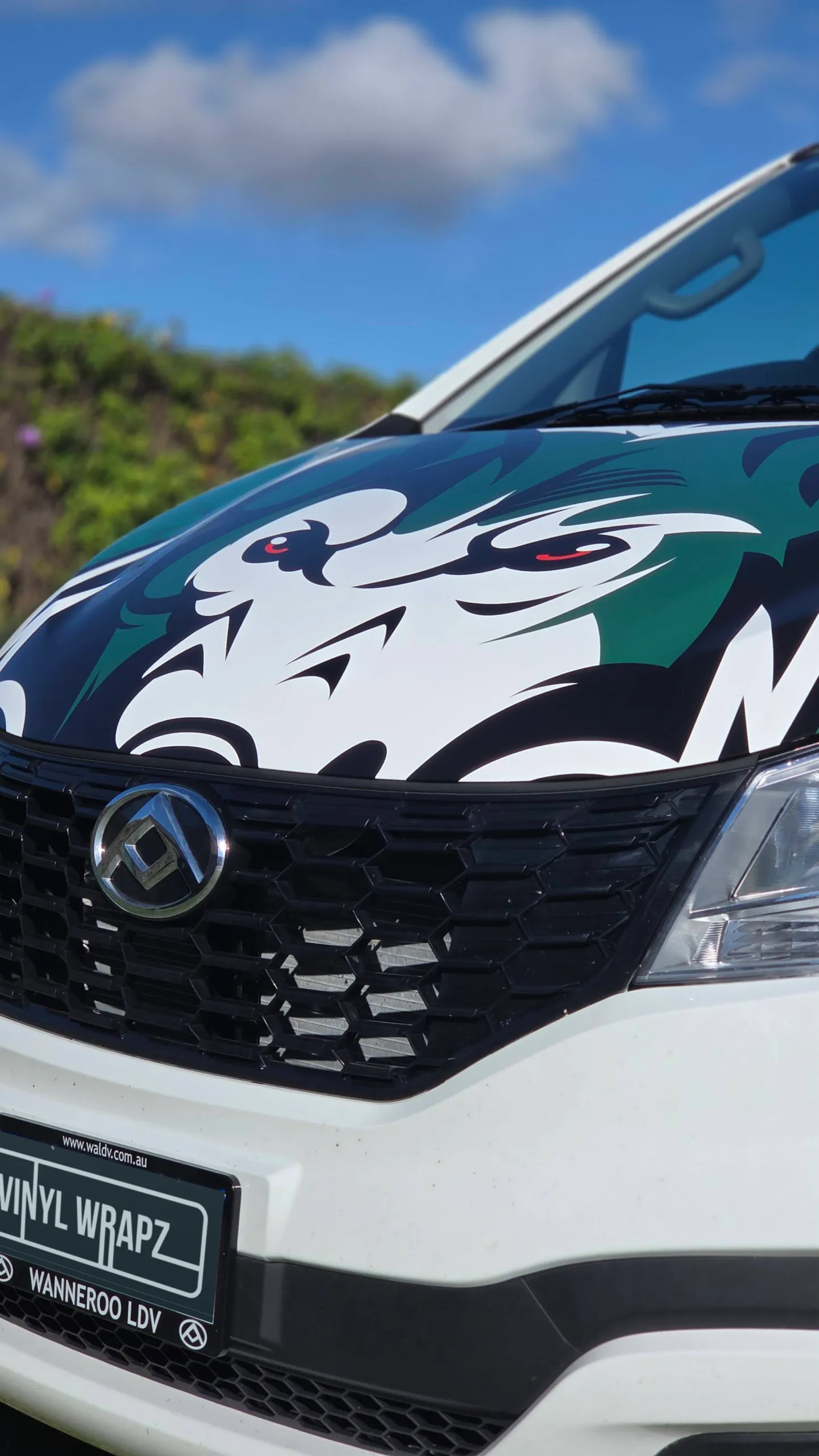 Green, black and white wolf artwork across the LDV van bonnet