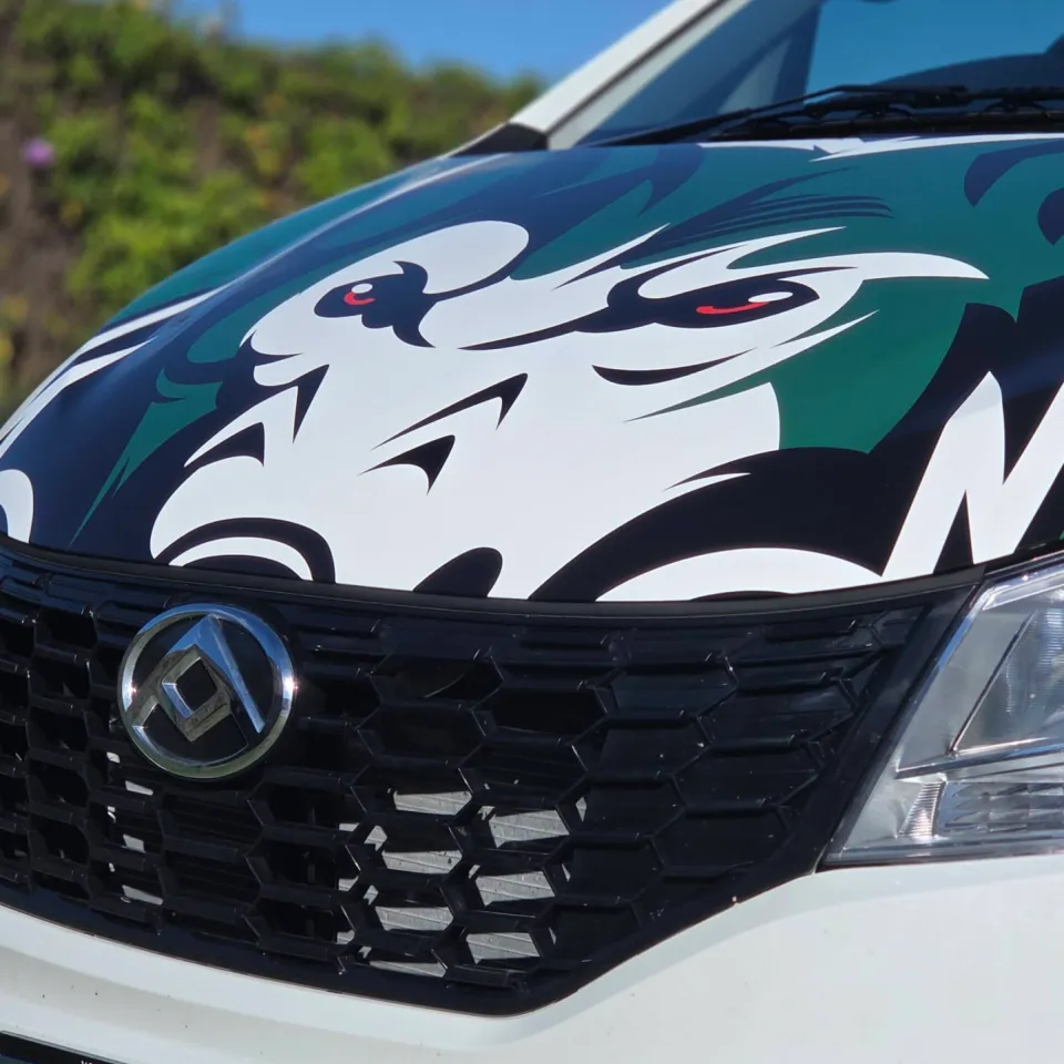 Green, black and white wolf artwork across the LDV van bonnet