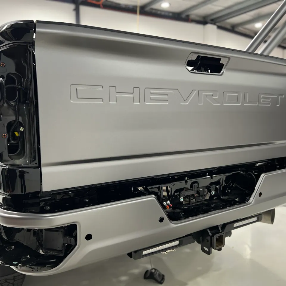 Matte anthracite film on a Chevrolet Silverado tailgate with rear lights removed