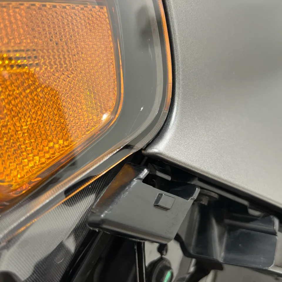 Close view of silver film meeting the indicator lens and exposed trim