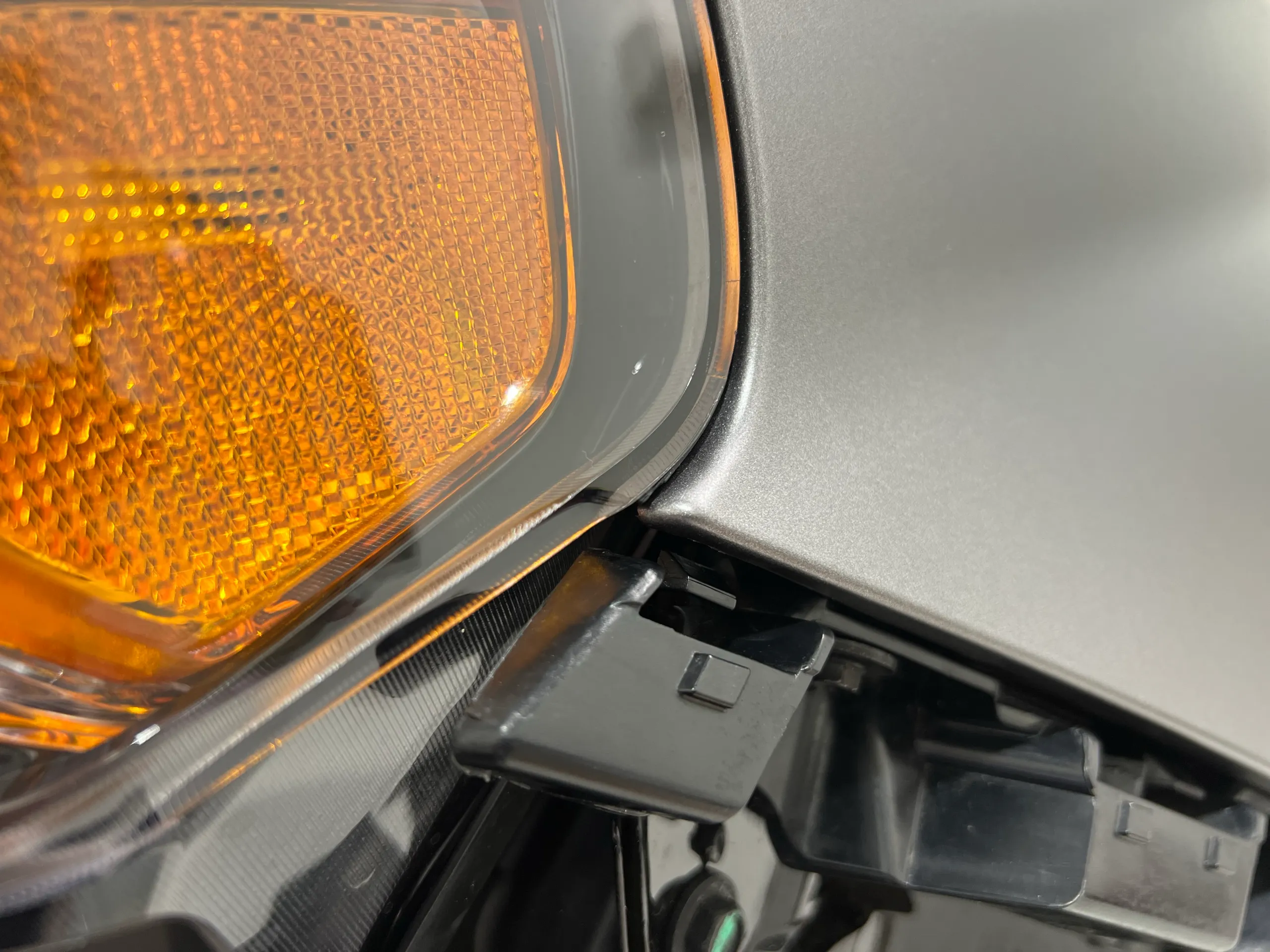 Close view of silver film meeting the indicator lens and exposed trim
